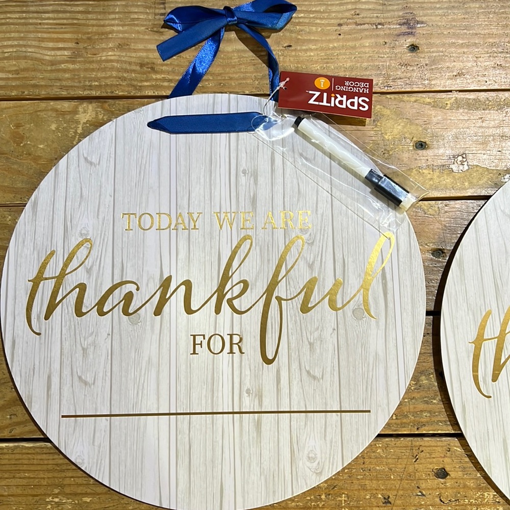 Spritz- “Today we are thankful for “ sign with blue ribbon and marker w eraser
